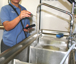 Inspector checking water temperature
