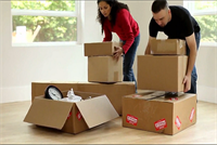 photo: woman and man packing