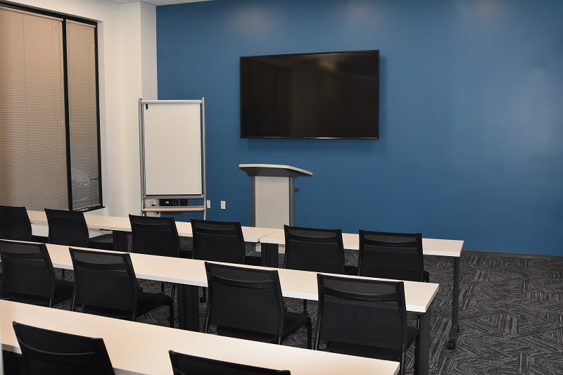 Training room with podium and television hanging on the wall
