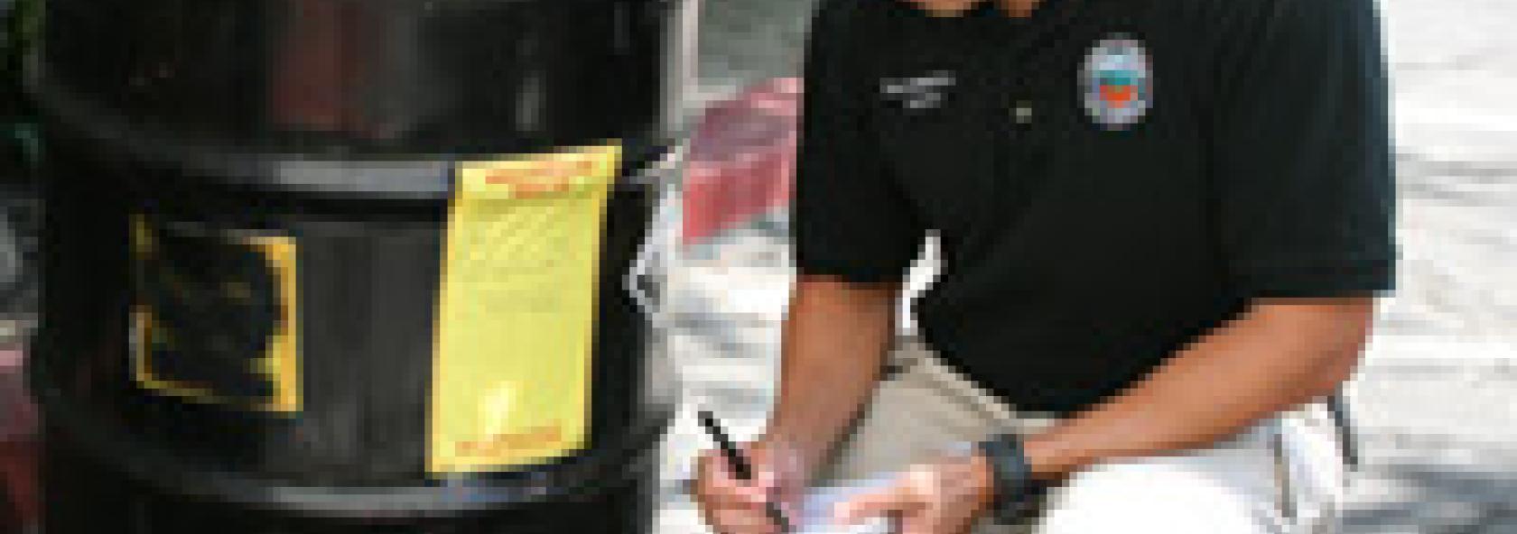 County Employee Beside Barrel