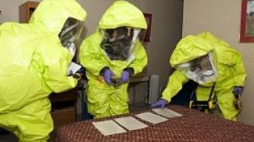 3 in Hazmat suits