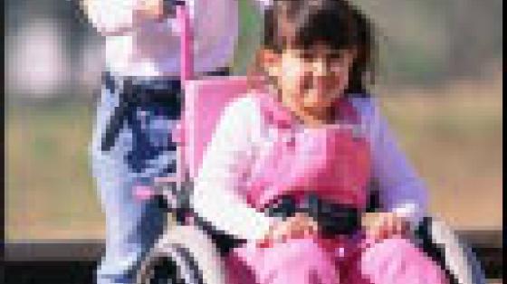 Child Behind Child Sitting Wheelchair