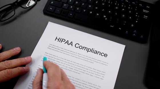 document on workstation titled "HIPAA Compliance"