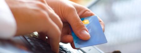 laptop and credit card being used
