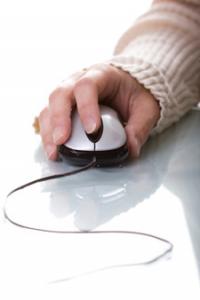 Hand on a computer mouse