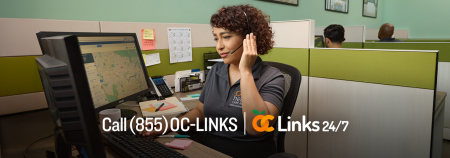 woman working on a computer with oc links number