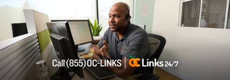 man working at desk with oc links logo and number (855) OC-LINKS